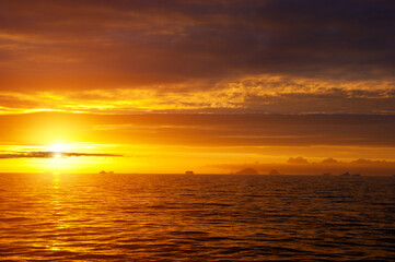 Golden sunset in antarctic sea.