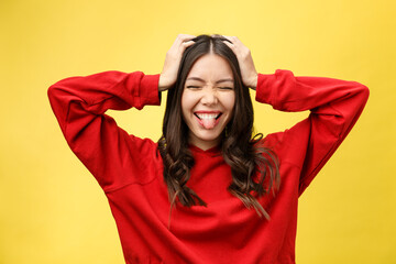 Fototapeta na wymiar Portrait Happy Asian girl is surprised she is excited.Yellow background studio