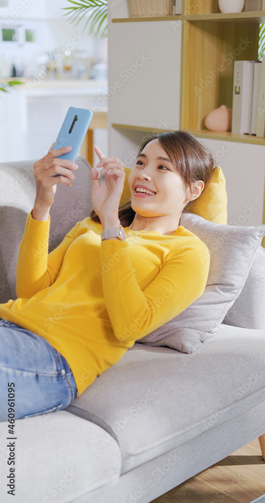 Poster woman using mobile at home