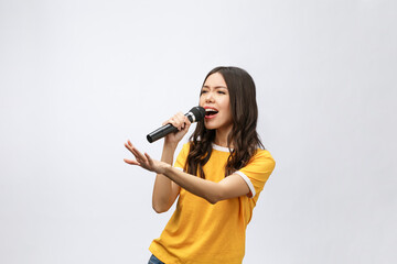 beautiful stylish woman singing karaoke isolated over white background. - obrazy, fototapety, plakaty