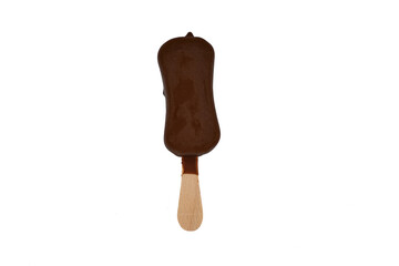 Photo directly above, a portion of ice cream on a stick in chocolate icing isolated on a white background