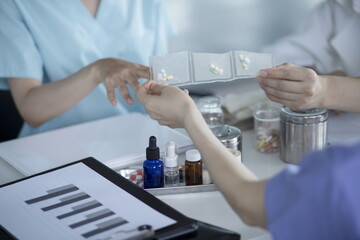 Close up of doctor holding pack of medicine