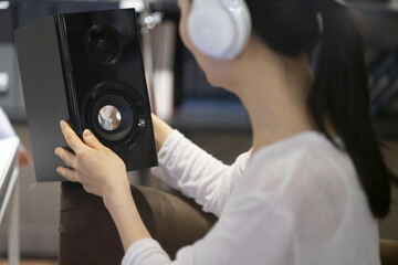 Fototapeta premium Woman listening to music with headphones