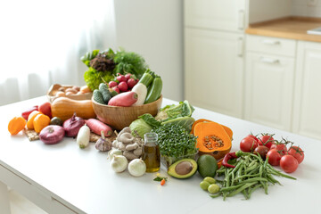 Vegetables on the table in a beautiful kitchen. High quality photo