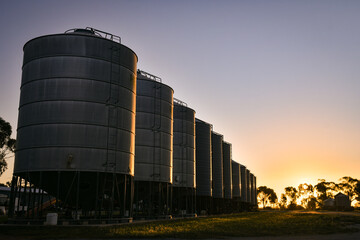 Silos in a row at sunset © Isaac