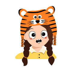 Avatar of girl with emotions panic, surprised face, shocked eyes in tiger hat. Cute kid with scared expression in carnival costume for New Year, Christmas and holiday. Head of adorable child