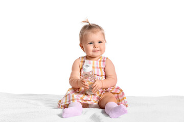 Cute baby girl with bottle of water on white background