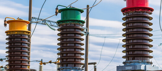 Three Detail of high voltage circuit breaker in a power substation on blue white cloud sky.high...