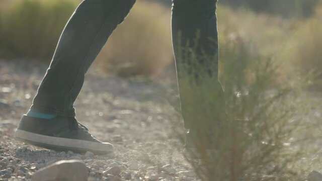 A man kicking literal rocks in the Nevada desert outside of Las Vegas