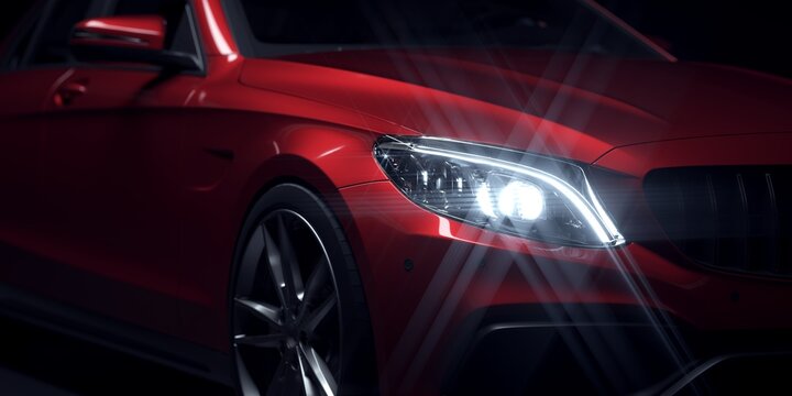 Close up of red sports car headlight.