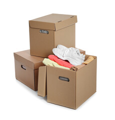 Wardrobe boxes with different clothes on white background