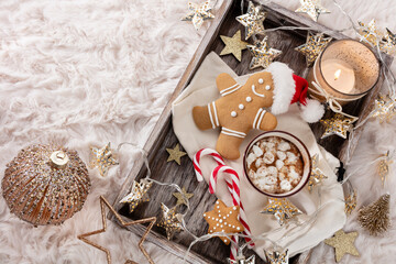 Fototapeta na wymiar Hot chocolate with marshmallow on wool background. Christmas concept