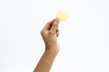 Hand holds potato chips. Isolated on a white background.