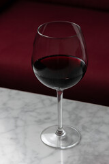 Wine glass at night on a marble table
