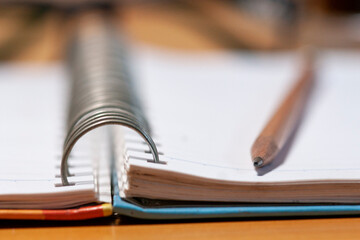 Spiral notebook  and  penci for background