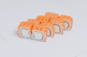 salmon rolls on a white background