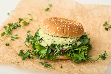Tasty vegetarian burger on white background