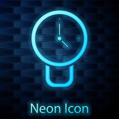 Glowing neon Clock icon isolated on brick wall background. Time symbol. Vector