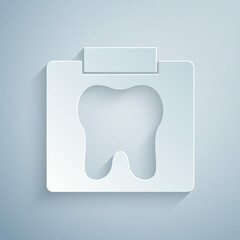 Fototapeta premium Paper cut X-ray of tooth icon isolated on grey background. Dental x-ray. Radiology image. Paper art style. Vector