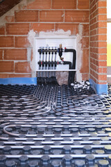Radiant floor heating hydronic manifold with flexible tubing. - obrazy, fototapety, plakaty