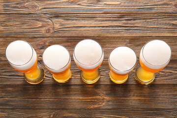 Glasses of cold beer on wooden background. Oktoberfest celebration