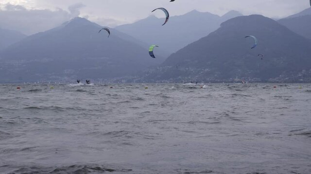 Lot Of Kitesurf Flying In The Wind on Como Lake Italy