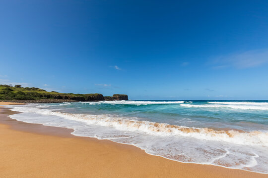 Clear blue sky over sandy Bombo Beach