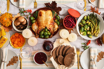 Table setting with delicious roasted turkey for Thanksgiving dinner