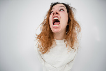 Close-up portrait of insane woman in straitjacket on white background.