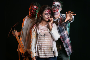 Scary zombies on dark background
