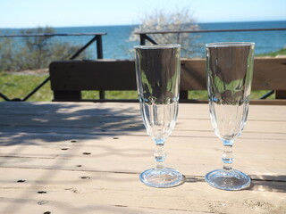 A glass of champagne on the terrace of a summer cafe 