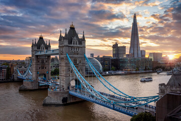 Beautiful sunset view to the Tower Bridge of London with the skyline along the Thames river, United Kingdom