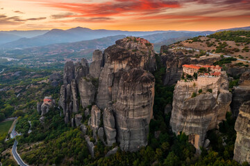 Mountain monastery and rocks in Meteora at sunset. Greece.