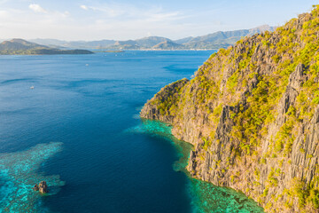 Fototapeta na wymiar Aerial view of turquoise tropical lagoon with limestone cliffs in Coron Island, Palawan, Philippines. UNESCO World Heritage.