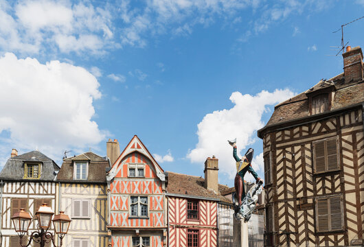 France, Yonne Department, Auxerre, Cadet Rousselle statue in front of historic half-timbered houses