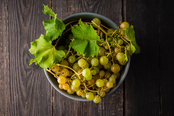 Ripe bunch of green grapes in bowl. Selective focus. Shallow depth of field.