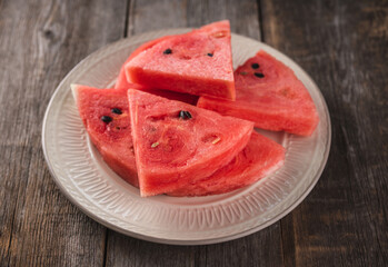 Fresh watermelon slices on the plate. Selective focus. Shallow depth of field.