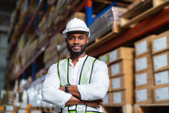 Portrait of African warehouse manager standing in a large distribution center. concept of career and occupation.