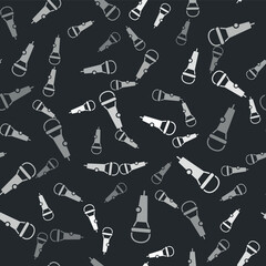 Grey Microphone icon isolated seamless pattern on black background. On air radio mic microphone. Speaker sign. Vector