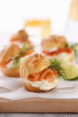 Profiteroles stuffed with cream cheese and salmon.