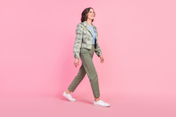 Full size photo of happy old woman walk empty space wear vintage outfit eco environment recycle isolated on pink color background