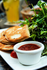 Delicious Mexican beef quesadillas with fresh lettuce and guacamole sauce