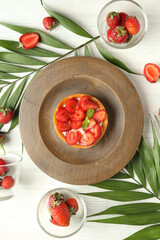 Concept of delicious food with strawberry tart, top view