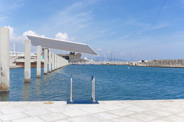 Obraz premium Pool ladder on a pier facing the Mediterranean Sea at the Forum in Barcelona