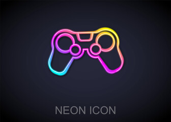 Glowing neon line Gamepad icon isolated on black background. Game controller. Vector