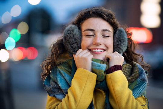 Woman enjoy warm clothes in winter evening