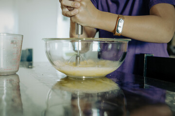 Old and worn volumetric measuring cup used for making cakes.