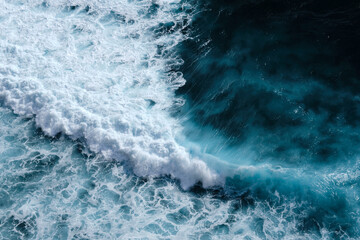 Fototapeta premium Aerial view to seething waves with foam. Waves of the sea meet each other during high tide and low tide