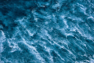 Aerial view to seething waves with foam. Waves of the sea meet each other during high tide and low tide - 460999626