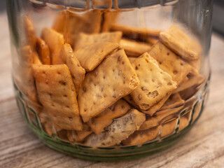 Close up of glass jar full of integral biscuits.